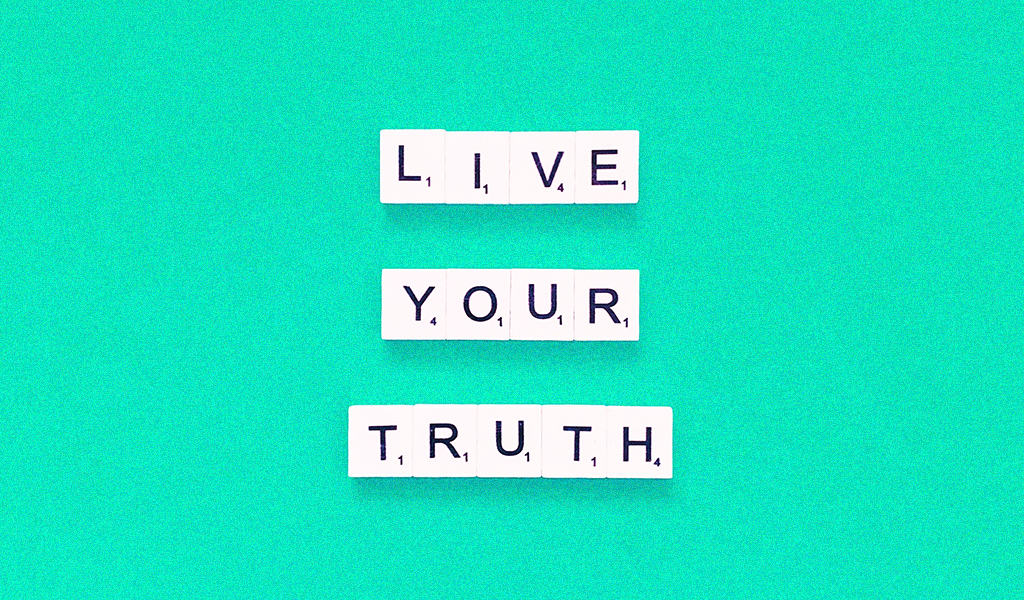 "Live your truth" on green background